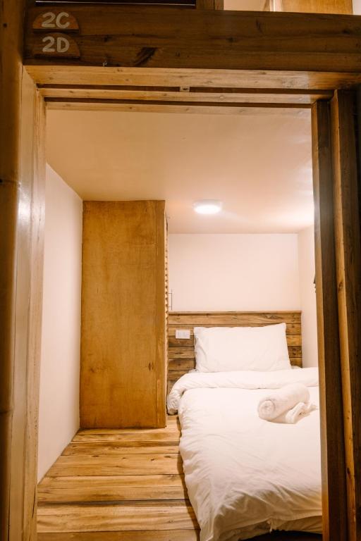 Rúm í herbergi á Happiness Hostel Siargao