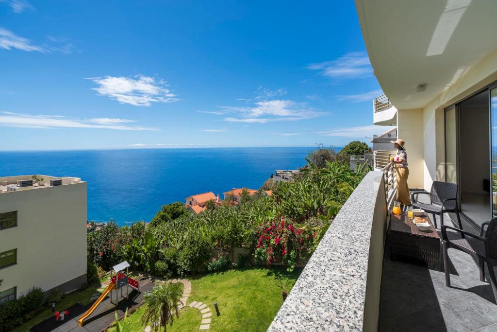 a balcony with a view of the ocean at Calheta Victory View by An Island Apart in Calheta