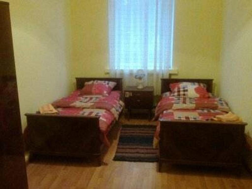Postel nebo postele na pokoji v ubytování Lemon Family GuestHouse