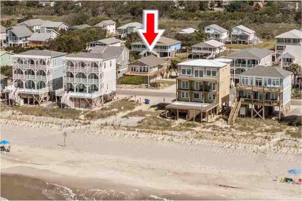 an aerial view of a beach with houses and a red arrow at Anchor Haven Ocean Views in Oak Island