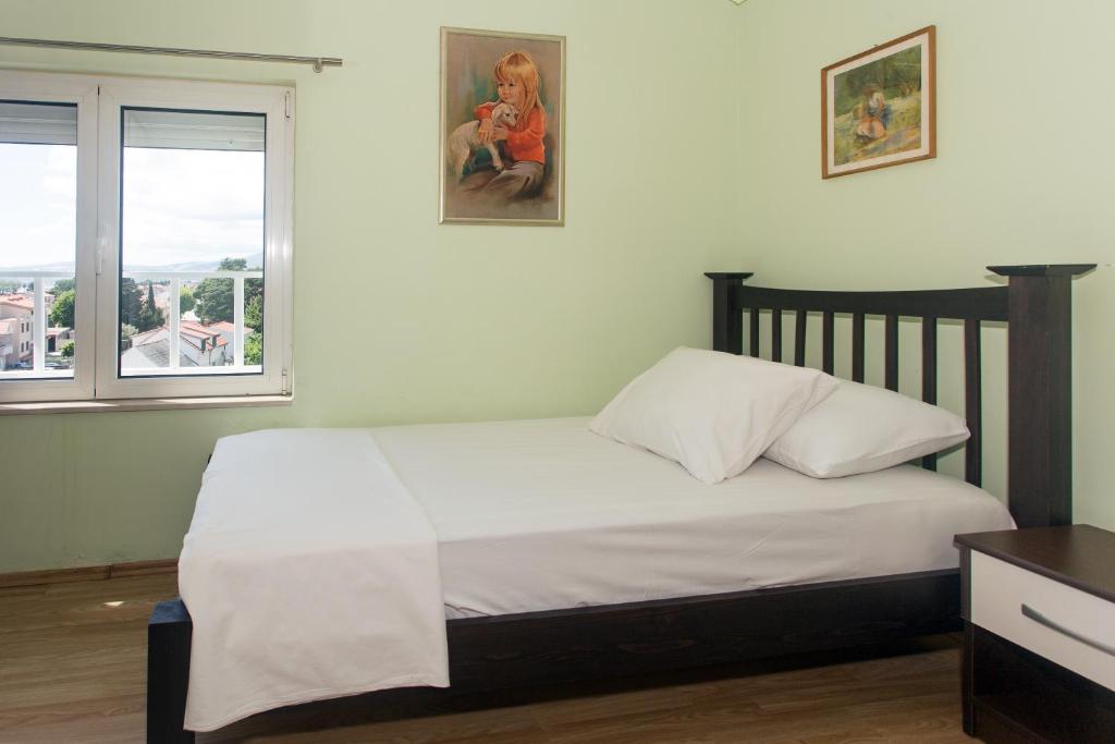 Posteľ alebo postele v izbe v ubytovaní Angolo Apartments