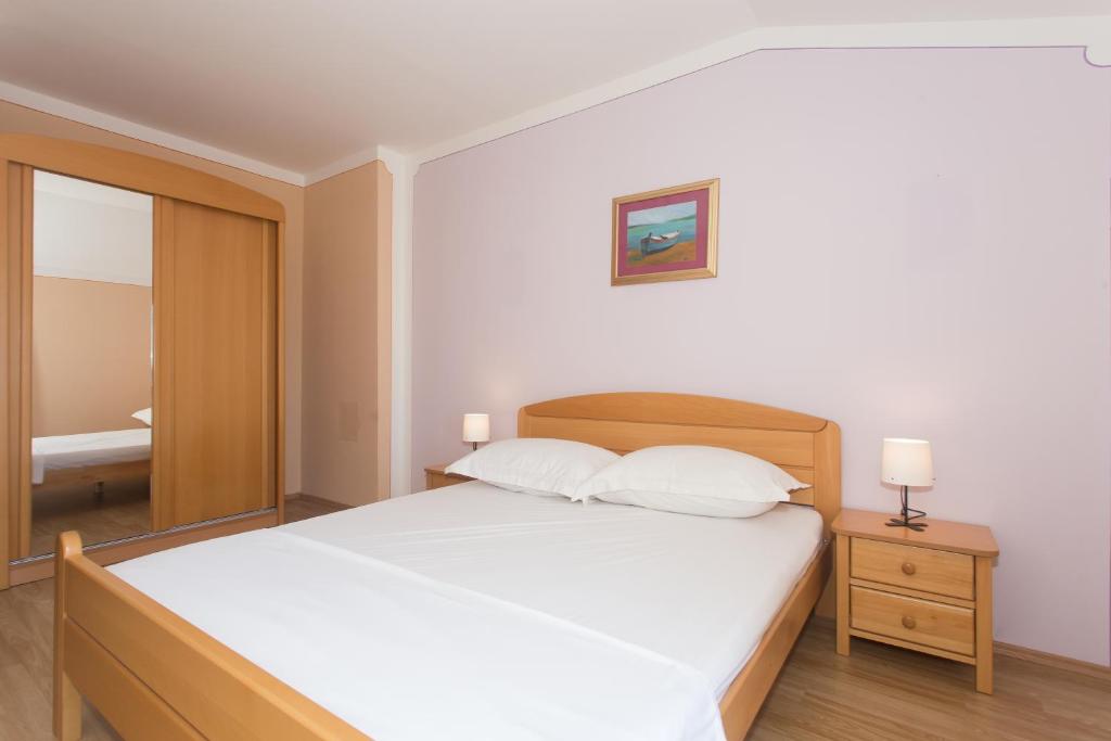 Posteľ alebo postele v izbe v ubytovaní Angolo Apartments