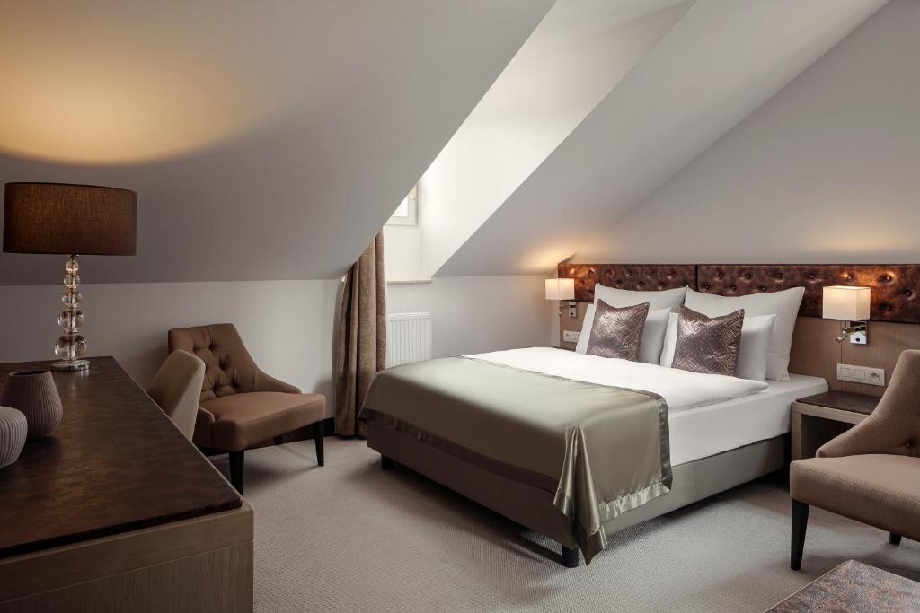 Postel nebo postele na pokoji v ubytování Boutique Hotel Saxonia