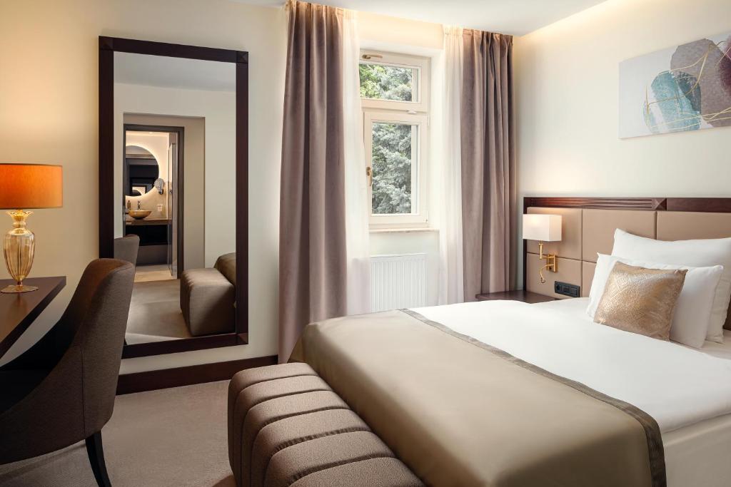 Postel nebo postele na pokoji v ubytování Boutique Hotel Saxonia