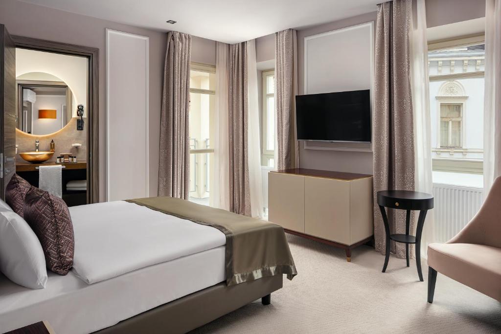 Postel nebo postele na pokoji v ubytování Boutique Hotel Saxonia