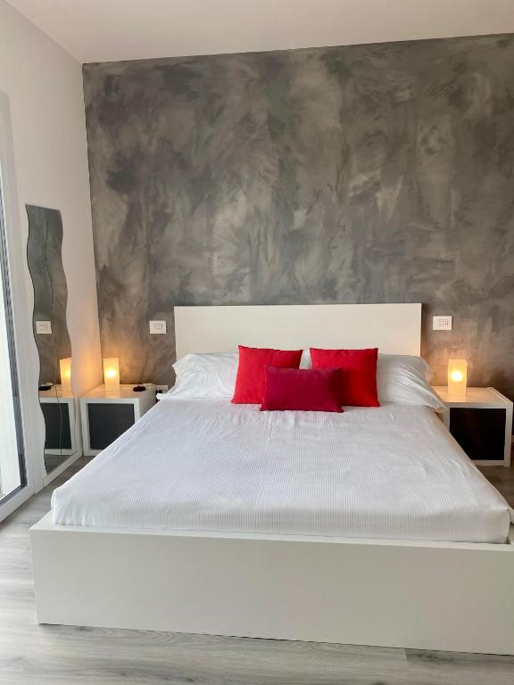 Łóżko lub łóżka w pokoju w obiekcie Villa Carlotta