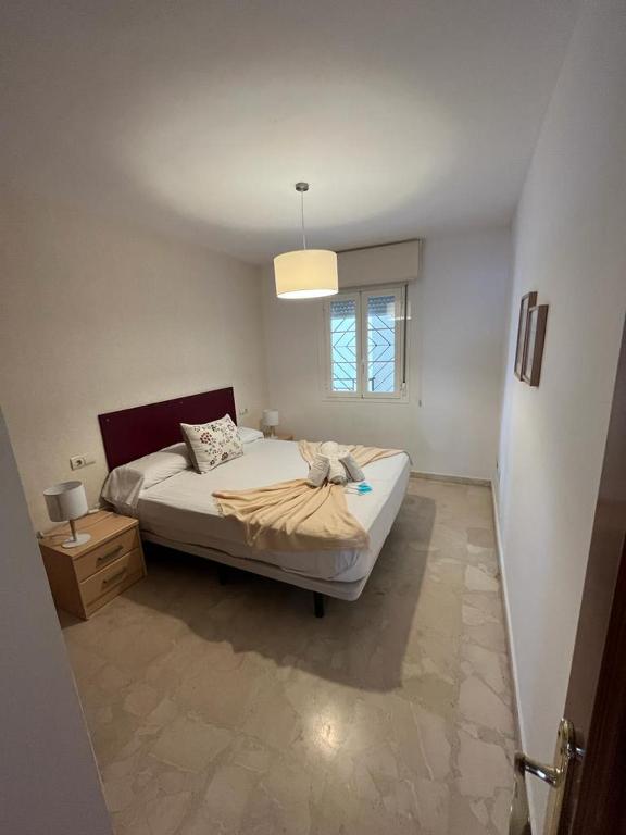 Posteľ alebo postele v izbe v ubytovaní Maravilloso apartamento en primera linea de playa con vistas al mar en Caleta de Vélez 2 C