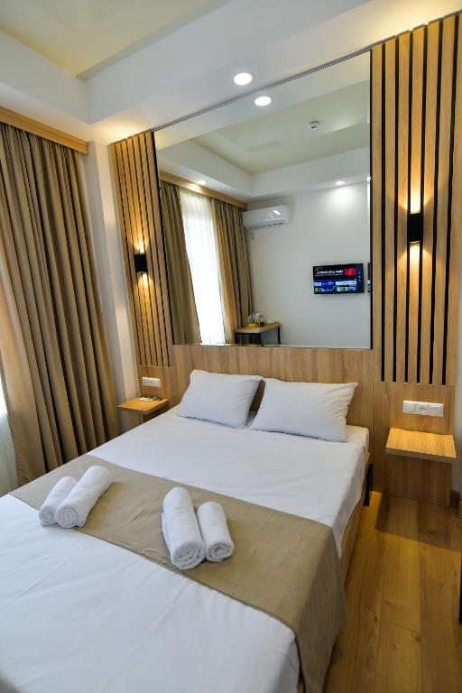 Postel nebo postele na pokoji v ubytování Euro Hotel Kutaisi