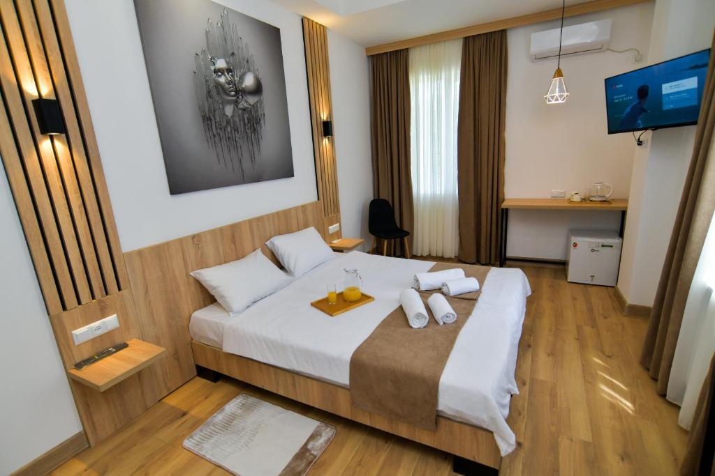 Postel nebo postele na pokoji v ubytování Euro Hotel Kutaisi