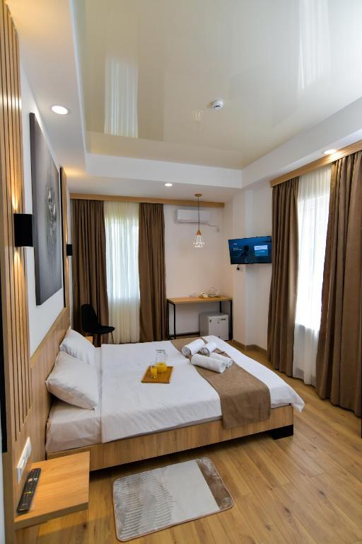 Postel nebo postele na pokoji v ubytování Euro Hotel Kutaisi