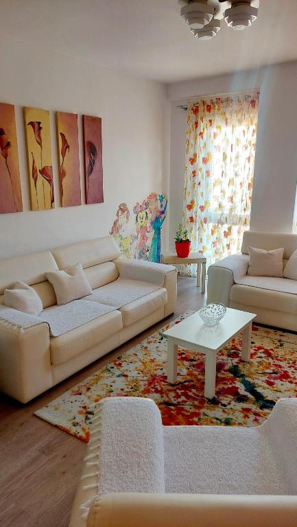 A seating area at Happy stories' apartment in city centre