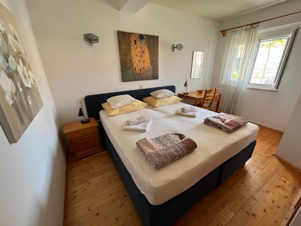 Postel nebo postele na pokoji v ubytování Apartments Šuda
