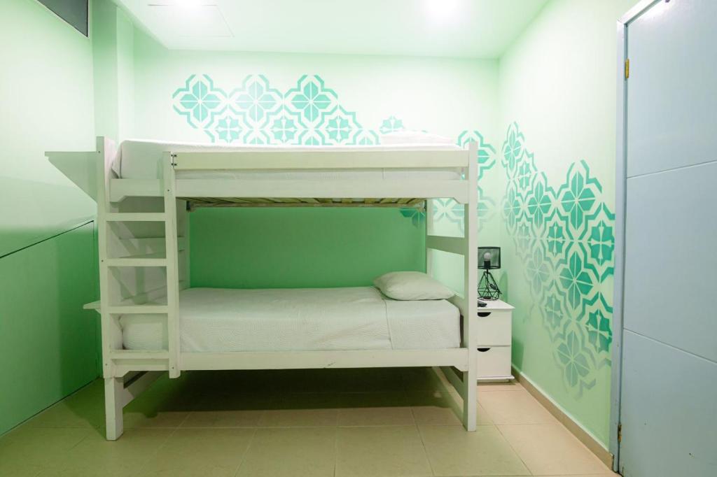 Postel nebo postele na pokoji v ubytování San Felicin Hostel