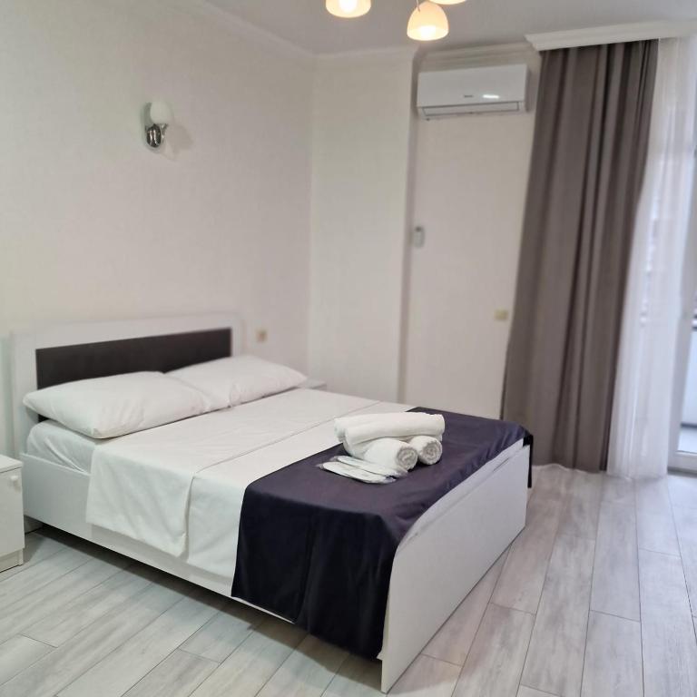 Postel nebo postele na pokoji v ubytování Salami Residence