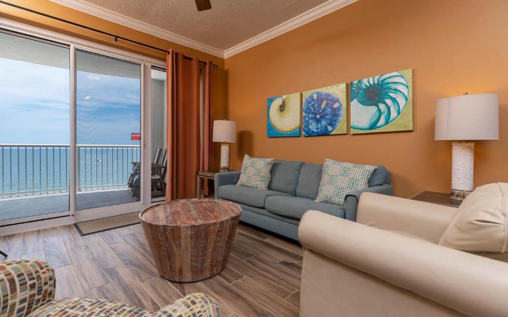 a living room with a couch and a view of the ocean at Island Royale 1103 condo in Gulf Shores