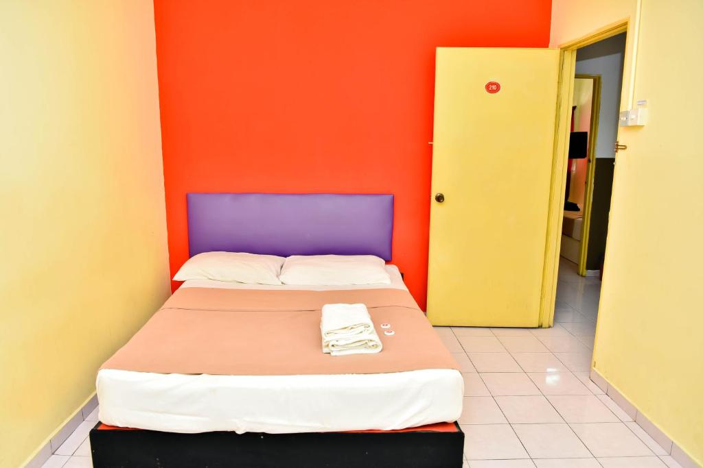 Postel nebo postele na pokoji v ubytování T FAMILY HOTEL