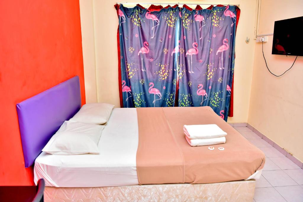 Postel nebo postele na pokoji v ubytování T FAMILY HOTEL