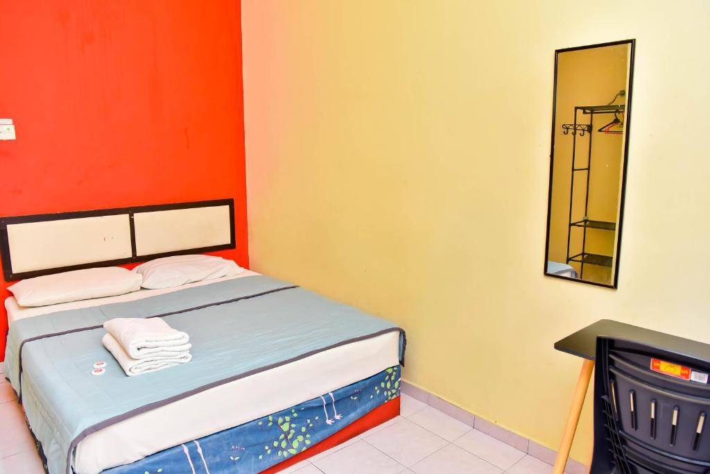 Postel nebo postele na pokoji v ubytování T FAMILY HOTEL