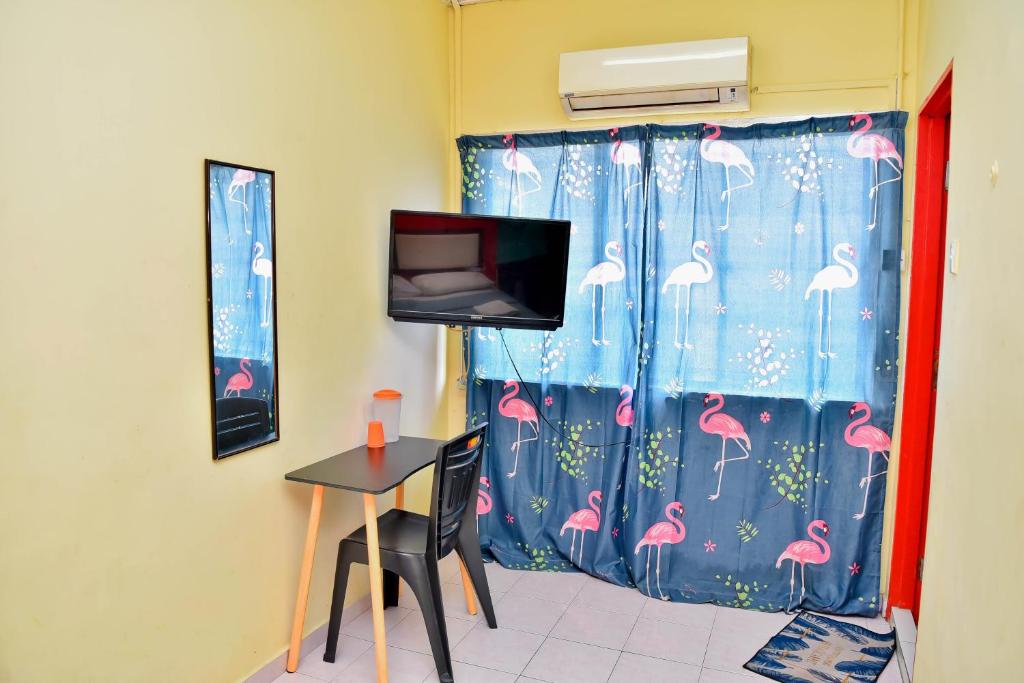 TV a/nebo společenská místnost v ubytování T FAMILY HOTEL