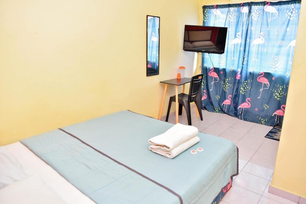 TV a/nebo společenská místnost v ubytování T FAMILY HOTEL