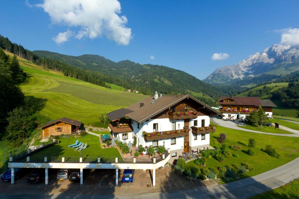 an aerial view of a house in the mountains at Apartments Haus Huber in Mühlbach am Hochkönig