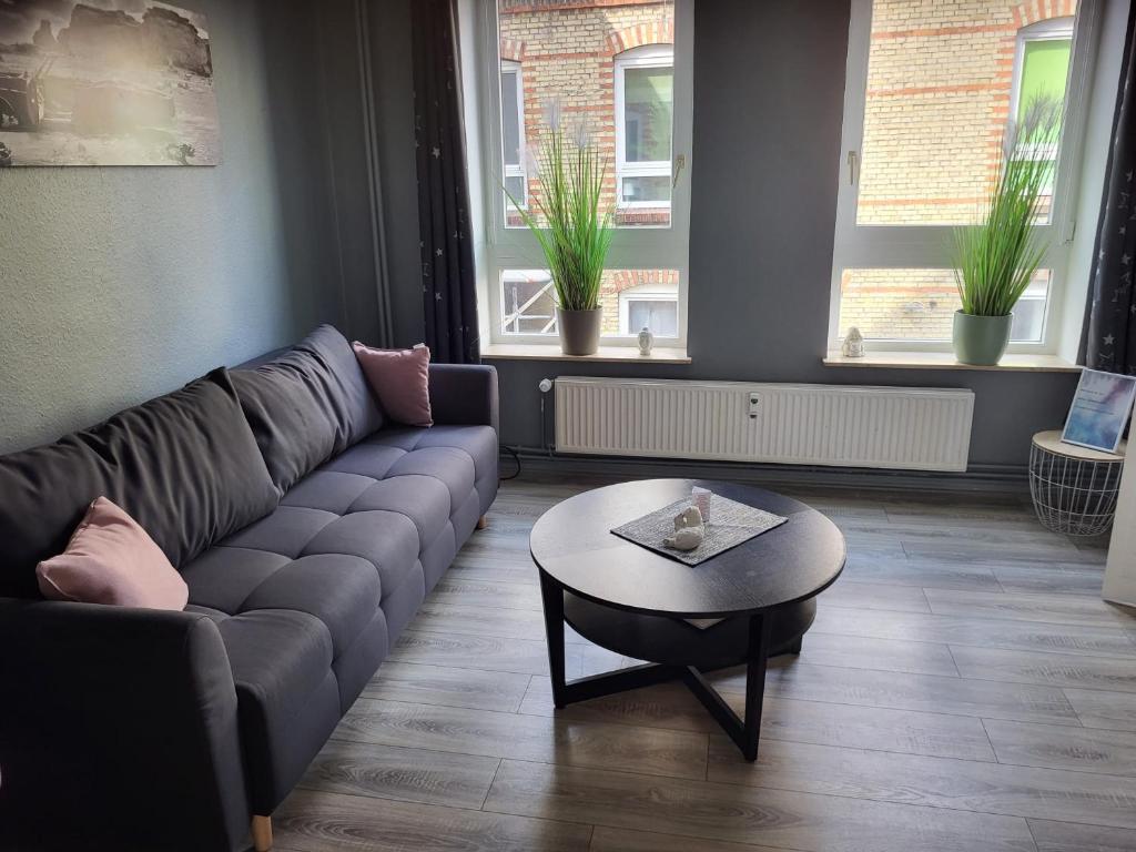 a living room with a couch and a table at Flensburg Zentrum 50 01 in Flensburg
