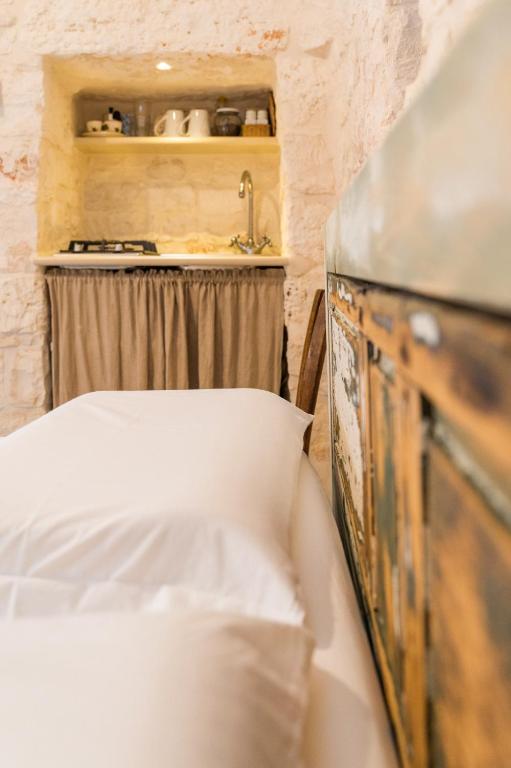 A bed or beds in a room at Trulli Francesca Ciclovia