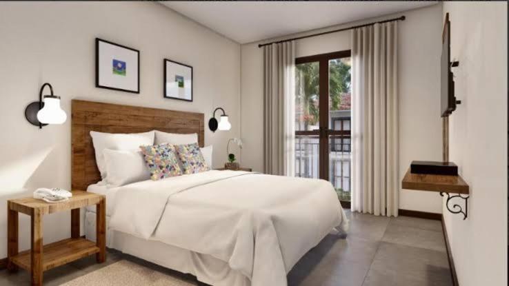 Ліжко або ліжка в номері Suites Quinta Santa Barbara
