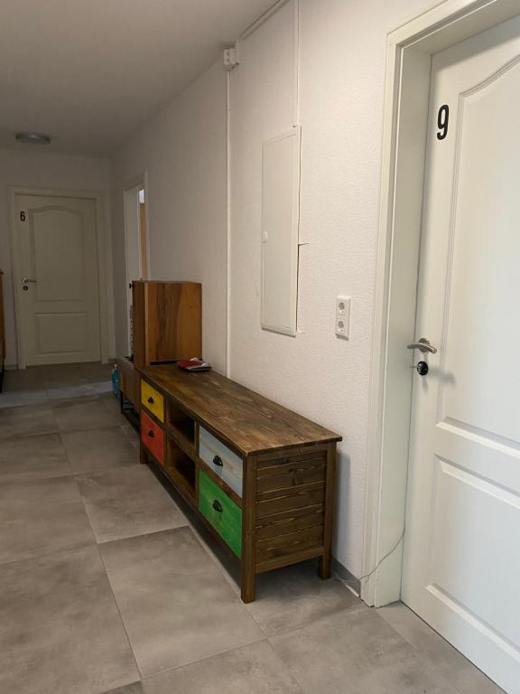 a room with a wooden dresser and a door at Era Home 2 in Murg