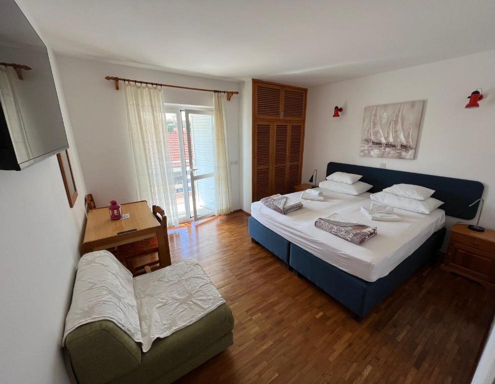 Postel nebo postele na pokoji v ubytování Apartments Šuda