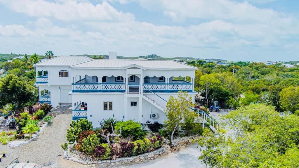 an aerial view of a white house with a balcony at Villa Serenity by the Water in Providenciales