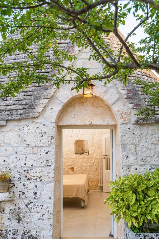 A bed or beds in a room at Trulli Francesca Ciclovia
