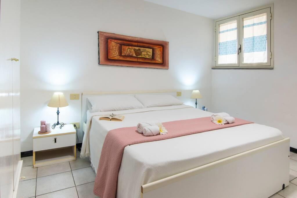 Ένα ή περισσότερα κρεβάτια σε δωμάτιο στο [Torregrande]APT.2 - Vicino al mare - Free Wi-Fi