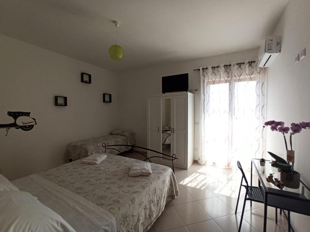 Postel nebo postele na pokoji v ubytování B&B In Sella