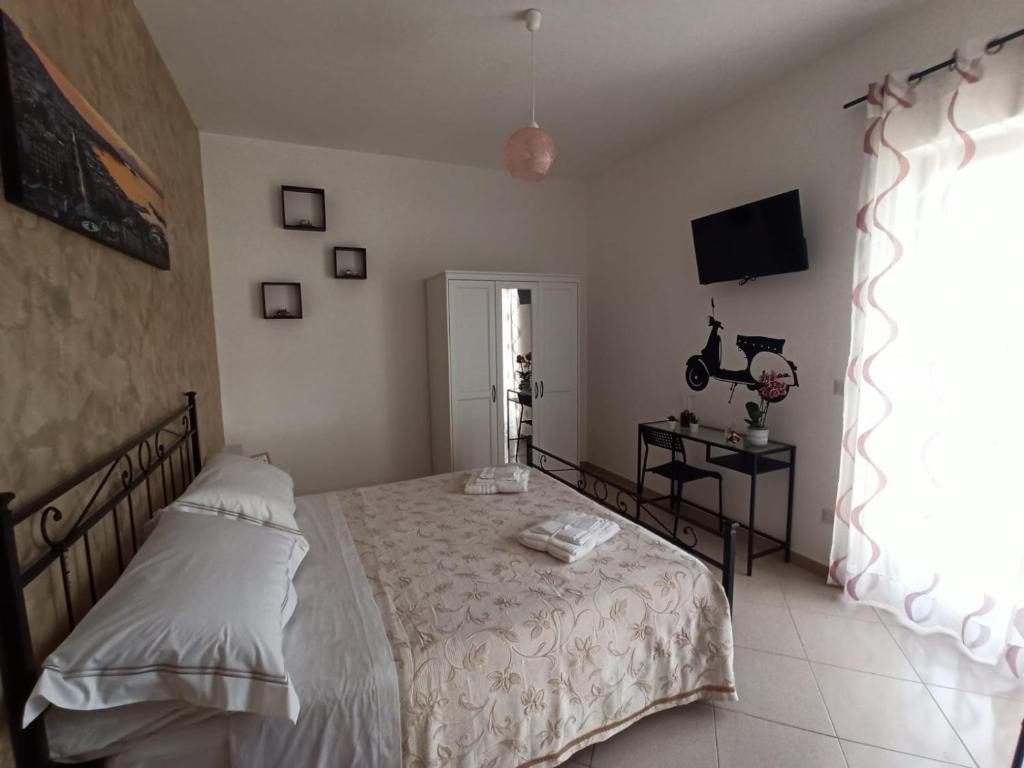 Postel nebo postele na pokoji v ubytování B&B In Sella