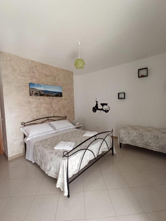 Postel nebo postele na pokoji v ubytování B&B In Sella