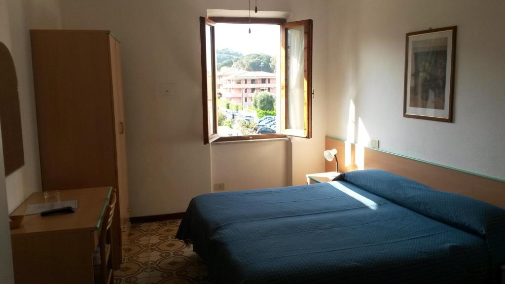 Postel nebo postele na pokoji v ubytování Hotel Anselmi