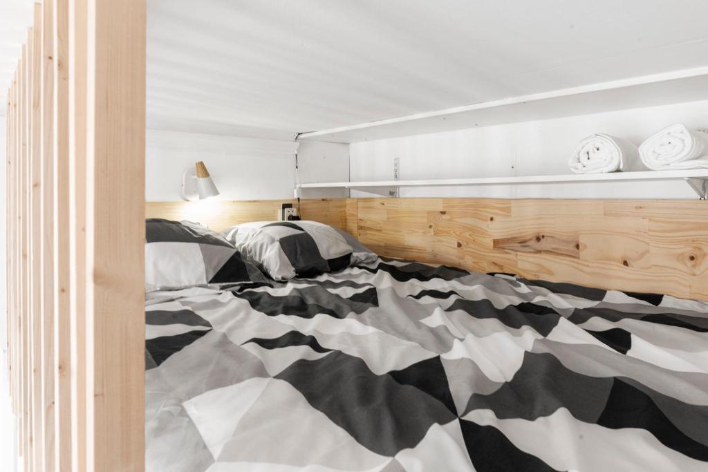 Postel nebo postele na pokoji v ubytování MontSéjour - Logement Climatisé Netflix, Mezzanine