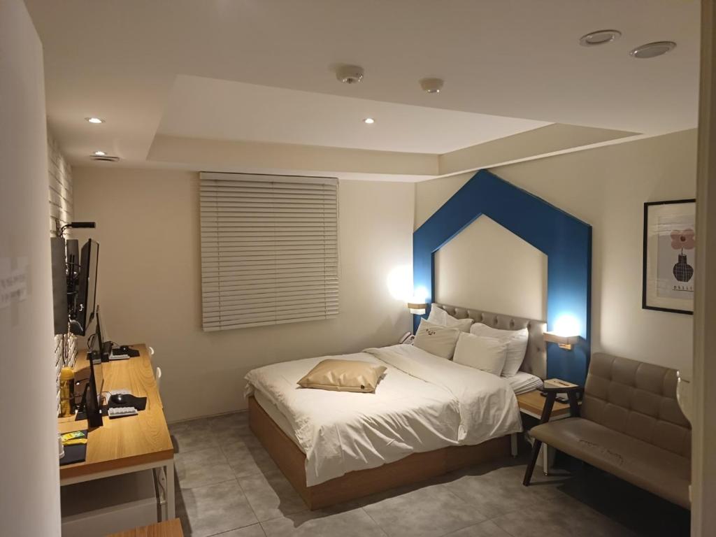 Postel nebo postele na pokoji v ubytování Hotel Yaja Hwajeong Station