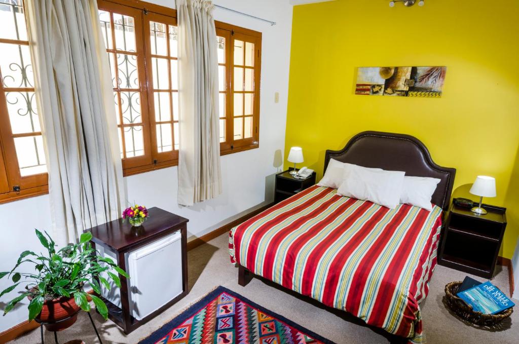 Postel nebo postele na pokoji v ubytování Hotel Boutique Selva Alegre