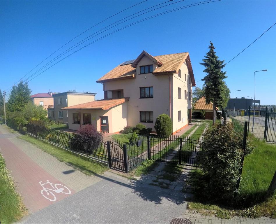 a house with a fence in front of a street at Apartamenty, mieszkanie na wynajem, 110m2, w Świdniku k Lublina in Świdnik