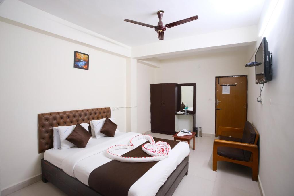 Postel nebo postele na pokoji v ubytování Ganesh Guest House
