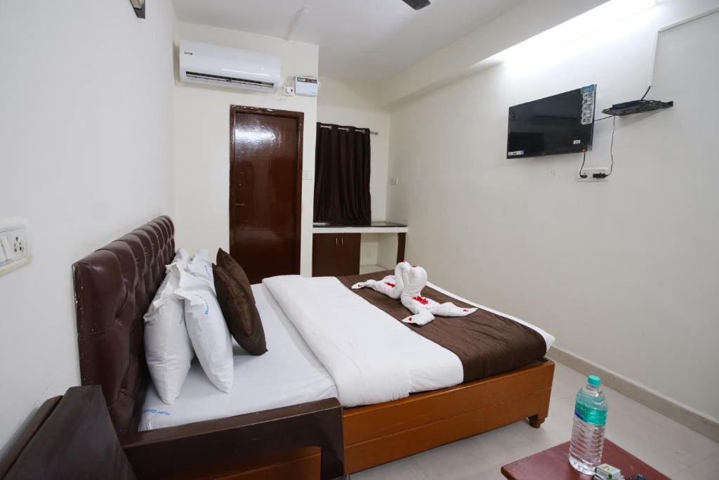 TV a/nebo společenská místnost v ubytování Ganesh Guest House