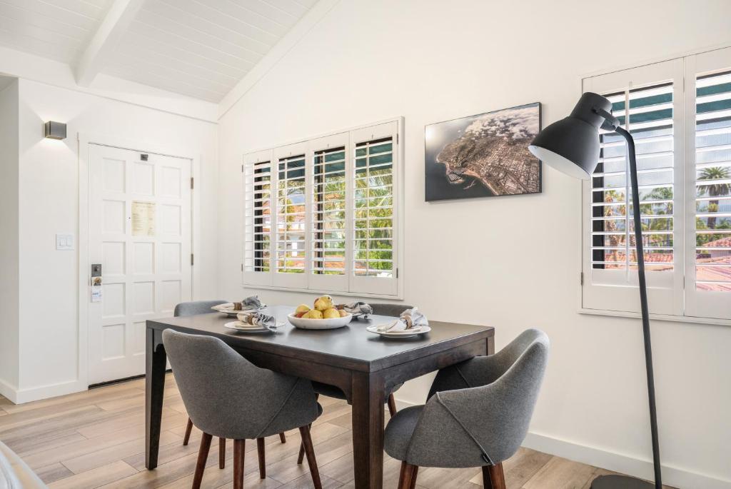 a dining room with a table and chairs at The Franciscan Hotel in Santa Barbara