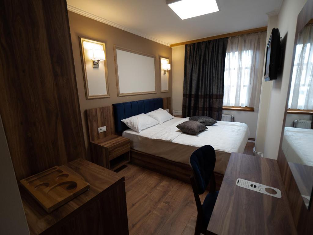 Postel nebo postele na pokoji v ubytování Amber Hotel