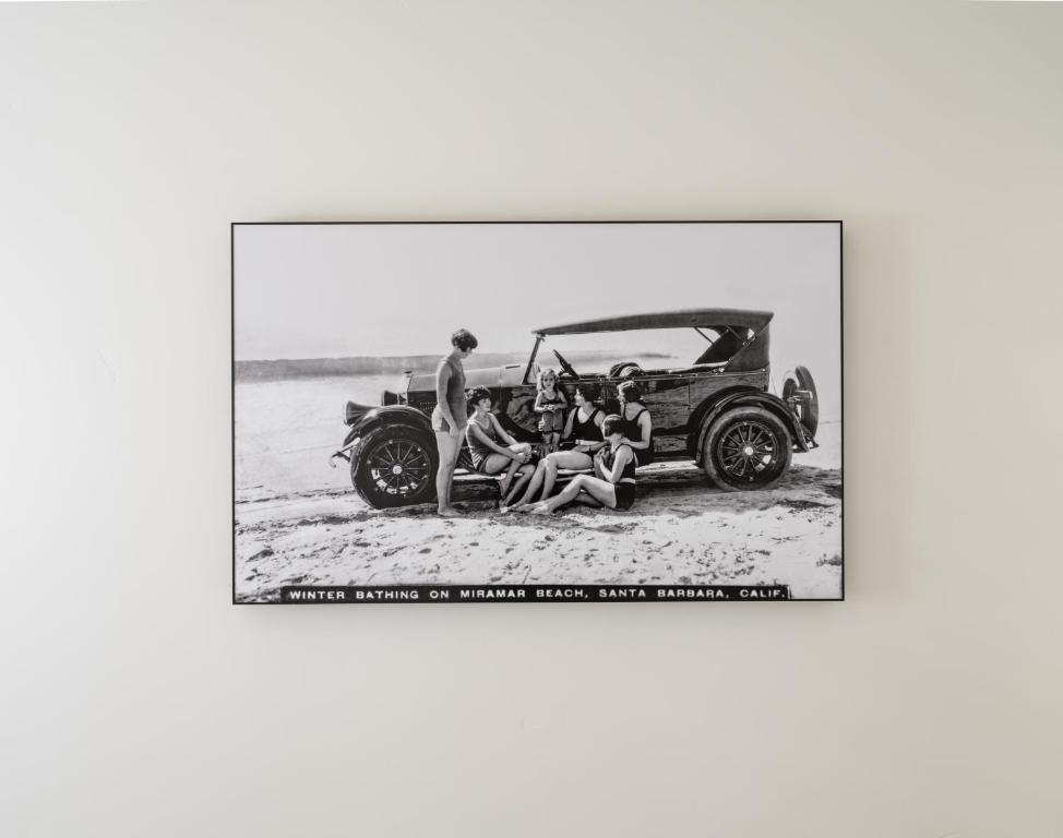 a group of people sitting in a car on the beach at The Franciscan Hotel in Santa Barbara