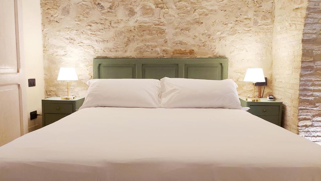 Postel nebo postele na pokoji v ubytování CASA OCRA