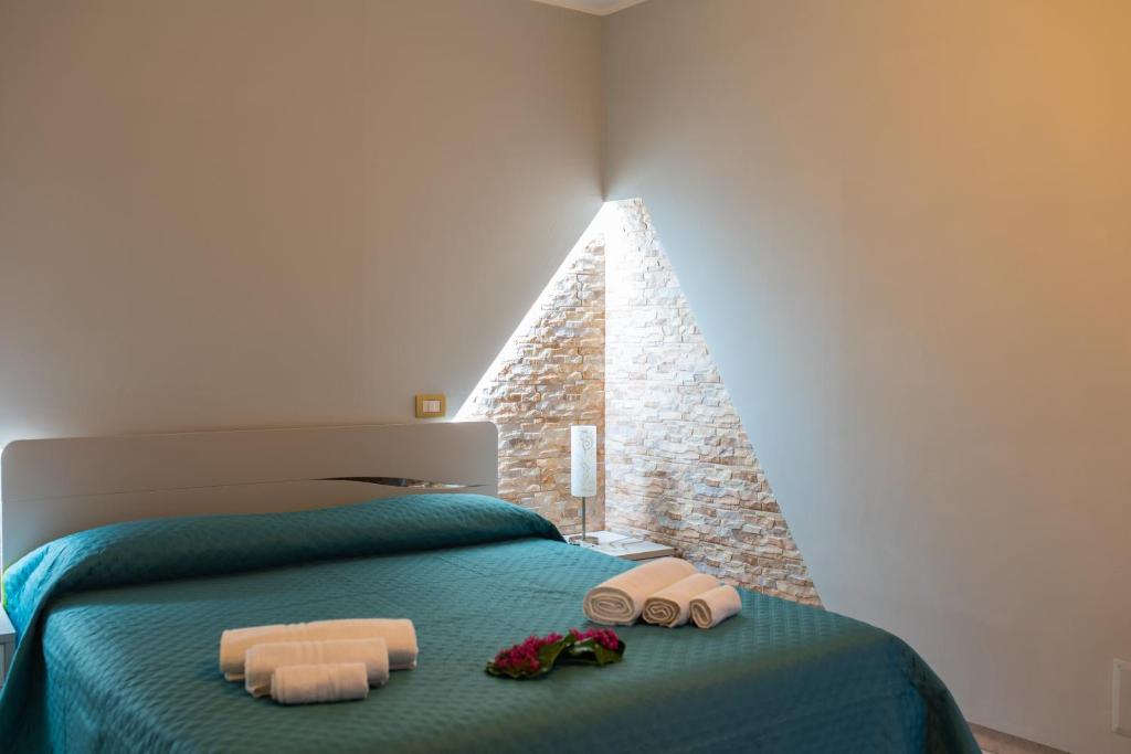 Postel nebo postele na pokoji v ubytování B&B al Vico Pepe