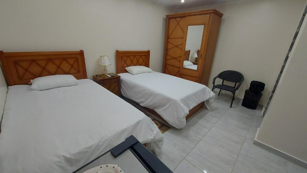 Postel nebo postele na pokoji v ubytování Ramses Guest House