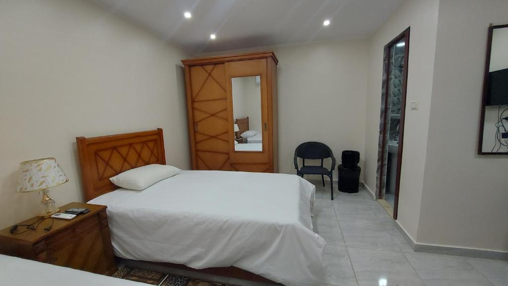 Postel nebo postele na pokoji v ubytování Ramses Guest House